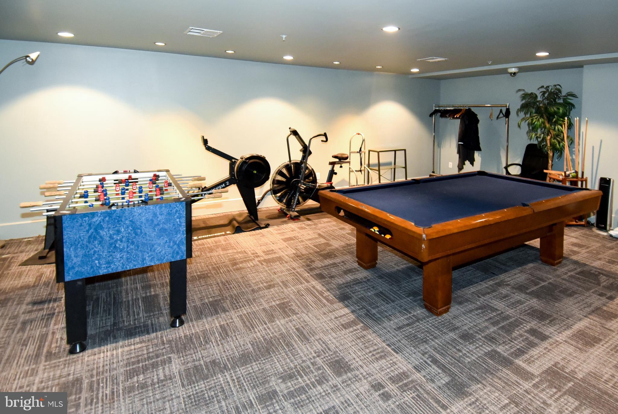 2100 11th Street Northwest, Unit G02 Washington, DC 20001 - Photo 32 of 36 a room with pool table and a couch