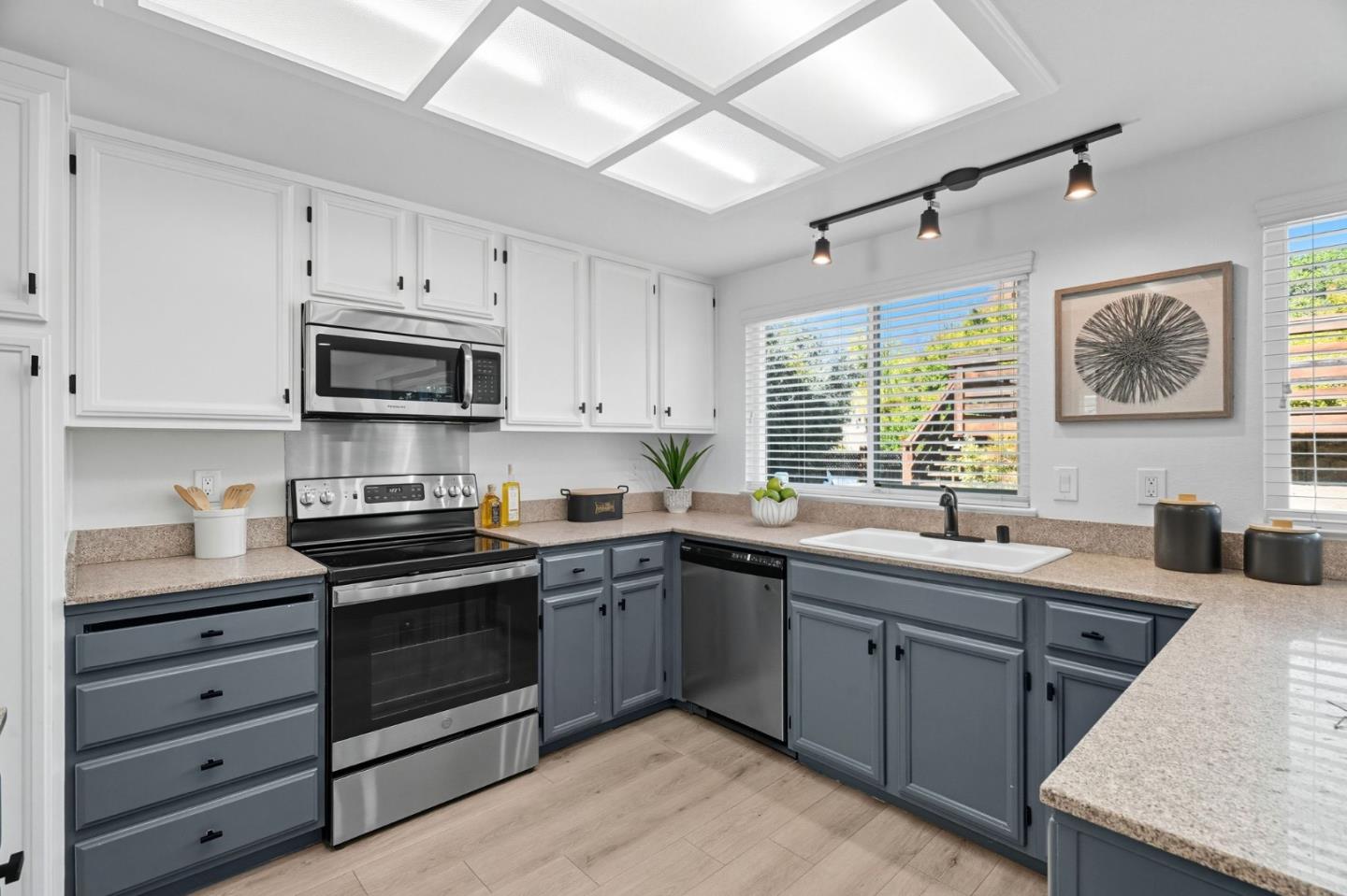 24392 Machado Court Hayward, CA 94541 - Photo 12 of 48 a kitchen with a sink stove and microwave