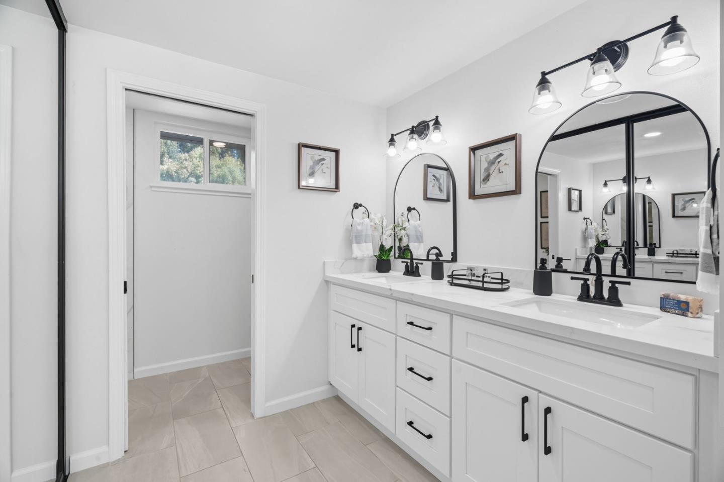 24392 Machado Court Hayward, CA 94541 - Photo 27 of 48 a bathroom with a double vanity sink and a mirror