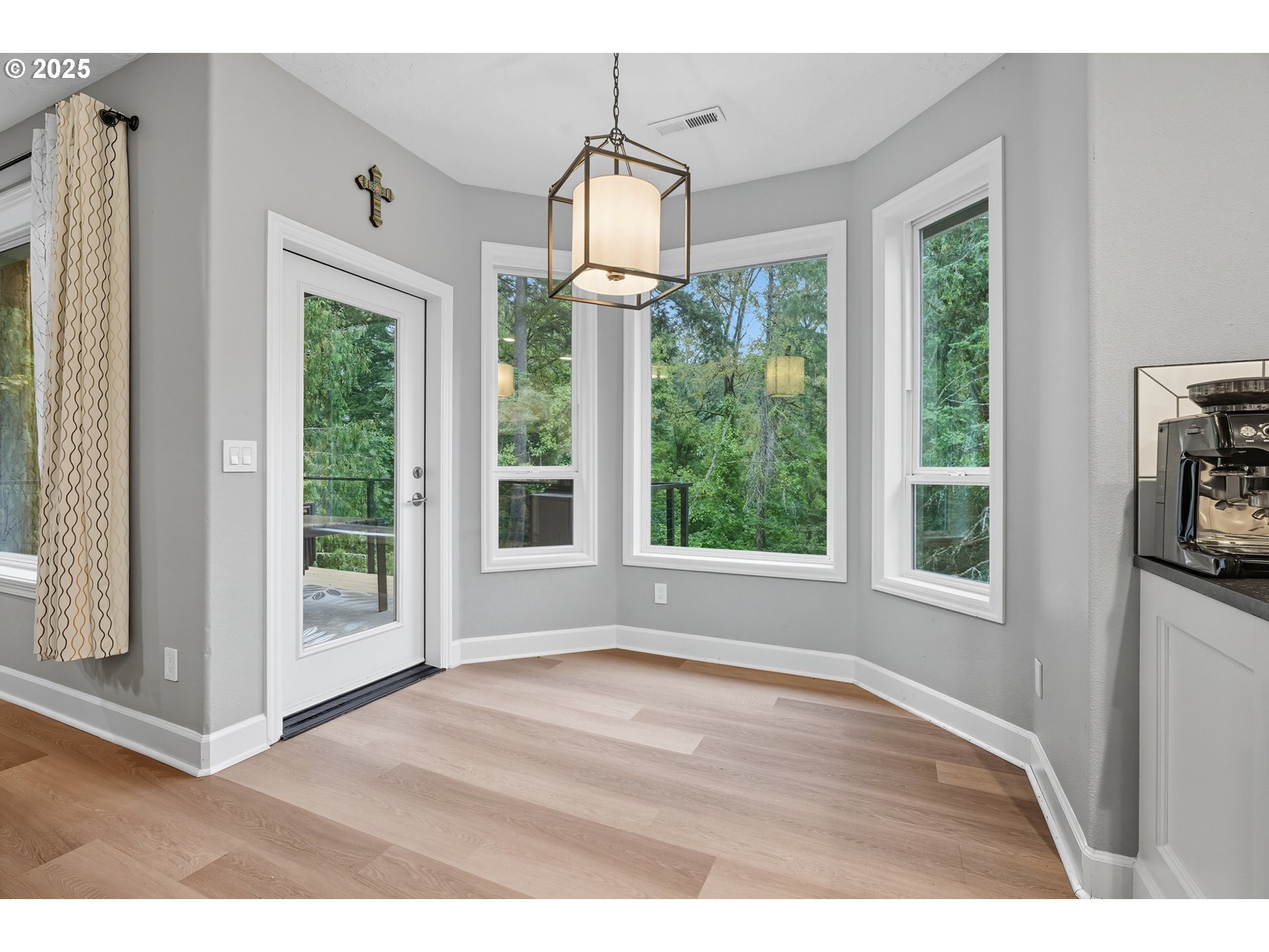 1109 Northwest Frazier Court Portland, OR 97229 - Photo 15 of 44 a view of an empty room with wooden floor and a window