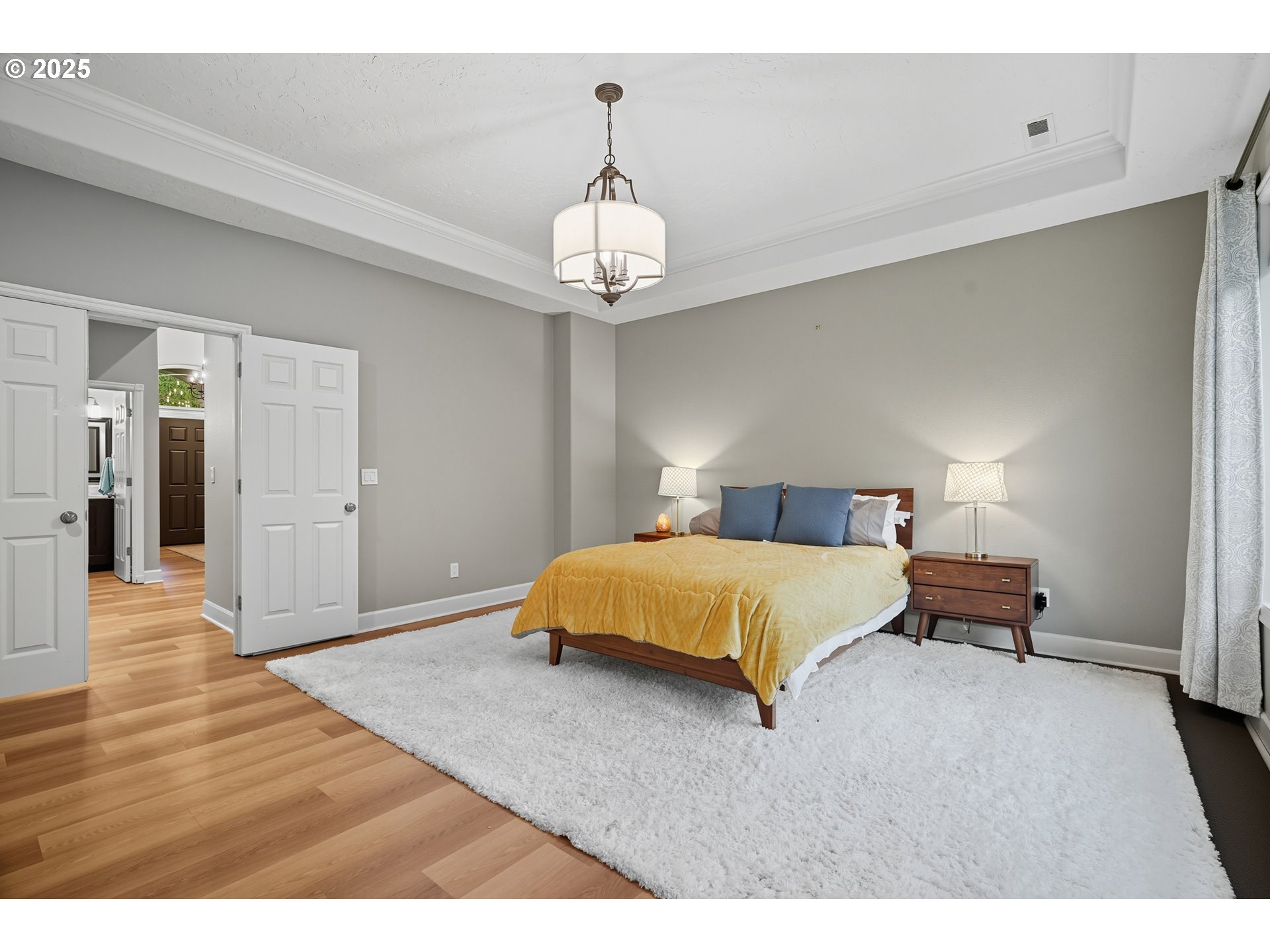 1109 Northwest Frazier Court Portland, OR 97229 - Photo 19 of 44 a bedroom with a bed and wooden floor