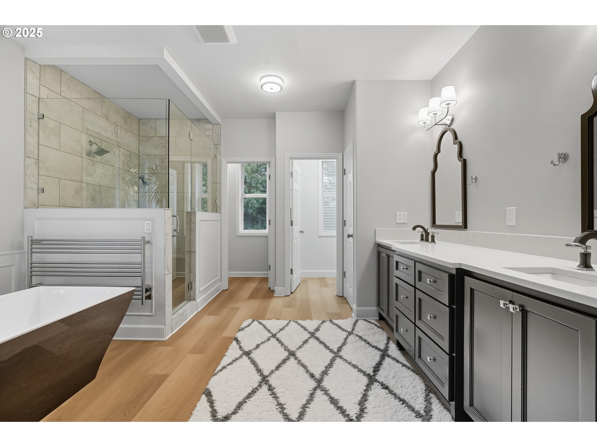 1109 Northwest Frazier Court Portland, OR 97229 - Photo 21 of 44 a spacious bathroom with a double vanity sink a mirror and a shower