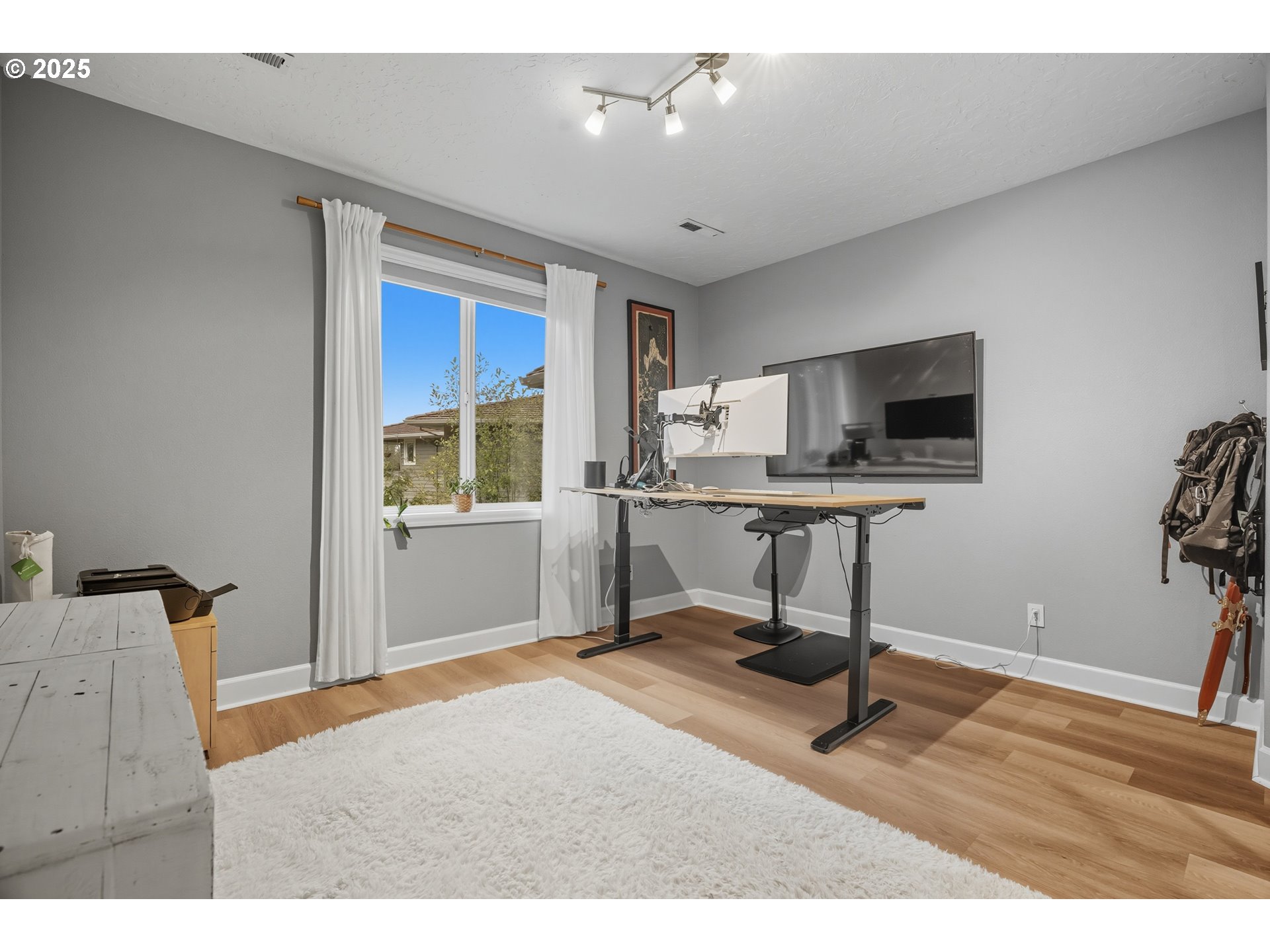 1109 Northwest Frazier Court Portland, OR 97229 - Photo 26 of 44 a view of a workspace with furniture and a window