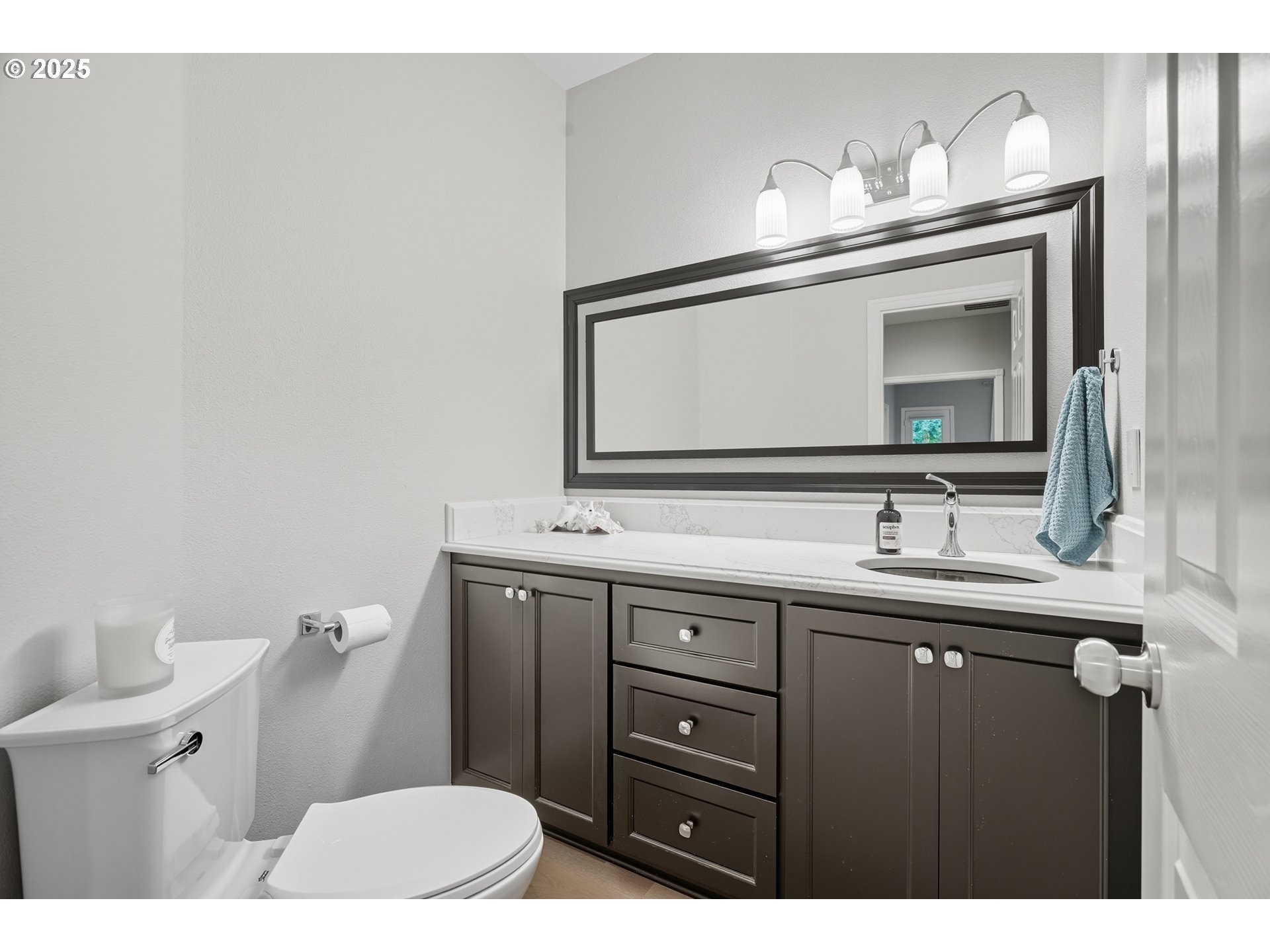 1109 Northwest Frazier Court Portland, OR 97229 - Photo 27 of 44 a bathroom with a sink and a mirror