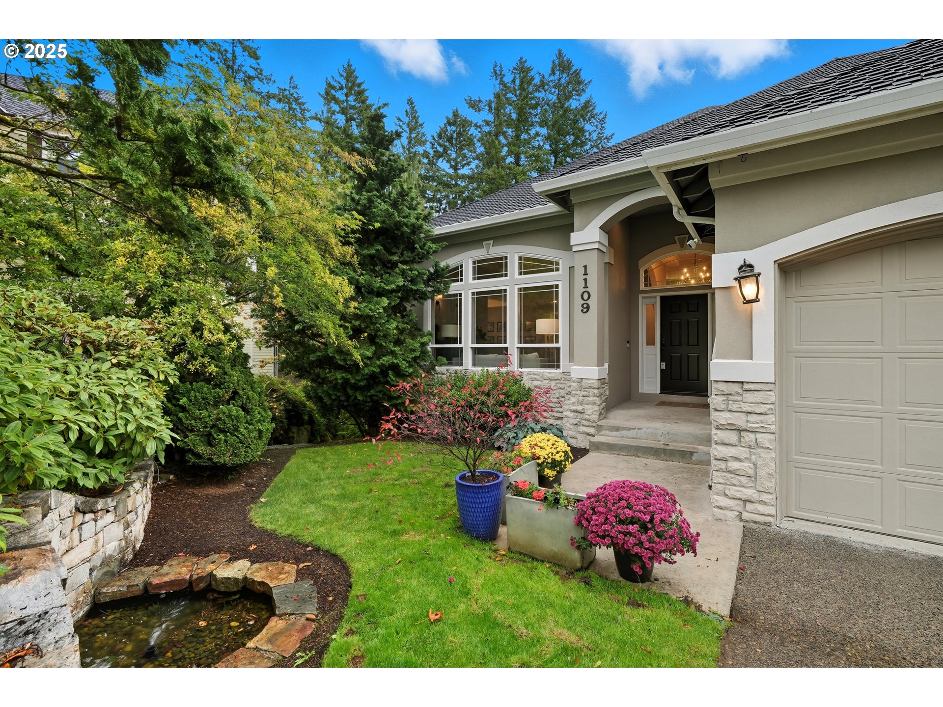 1109 Northwest Frazier Court Portland, OR 97229 - Photo 3 of 44 a view of a chair and table in backyard of the house
