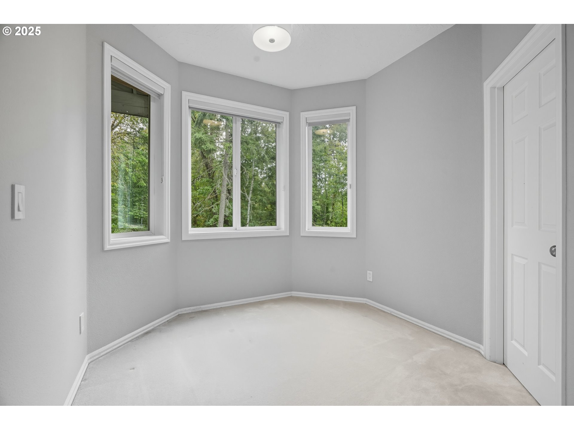 1109 Northwest Frazier Court Portland, OR 97229 - Photo 31 of 44 an empty room with windows