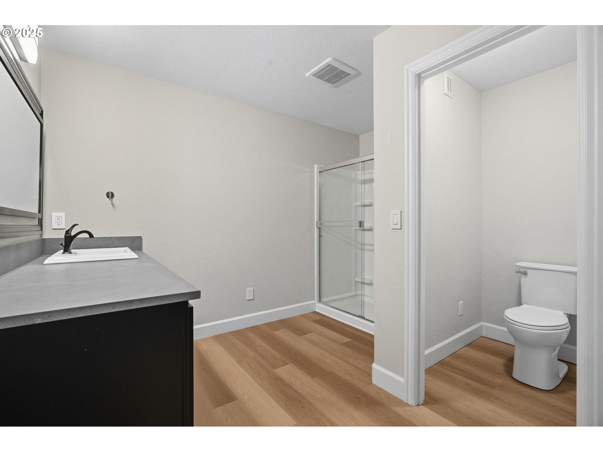 1109 Northwest Frazier Court Portland, OR 97229 - Photo 37 of 44 a bathroom with a sink toilet and a mirror