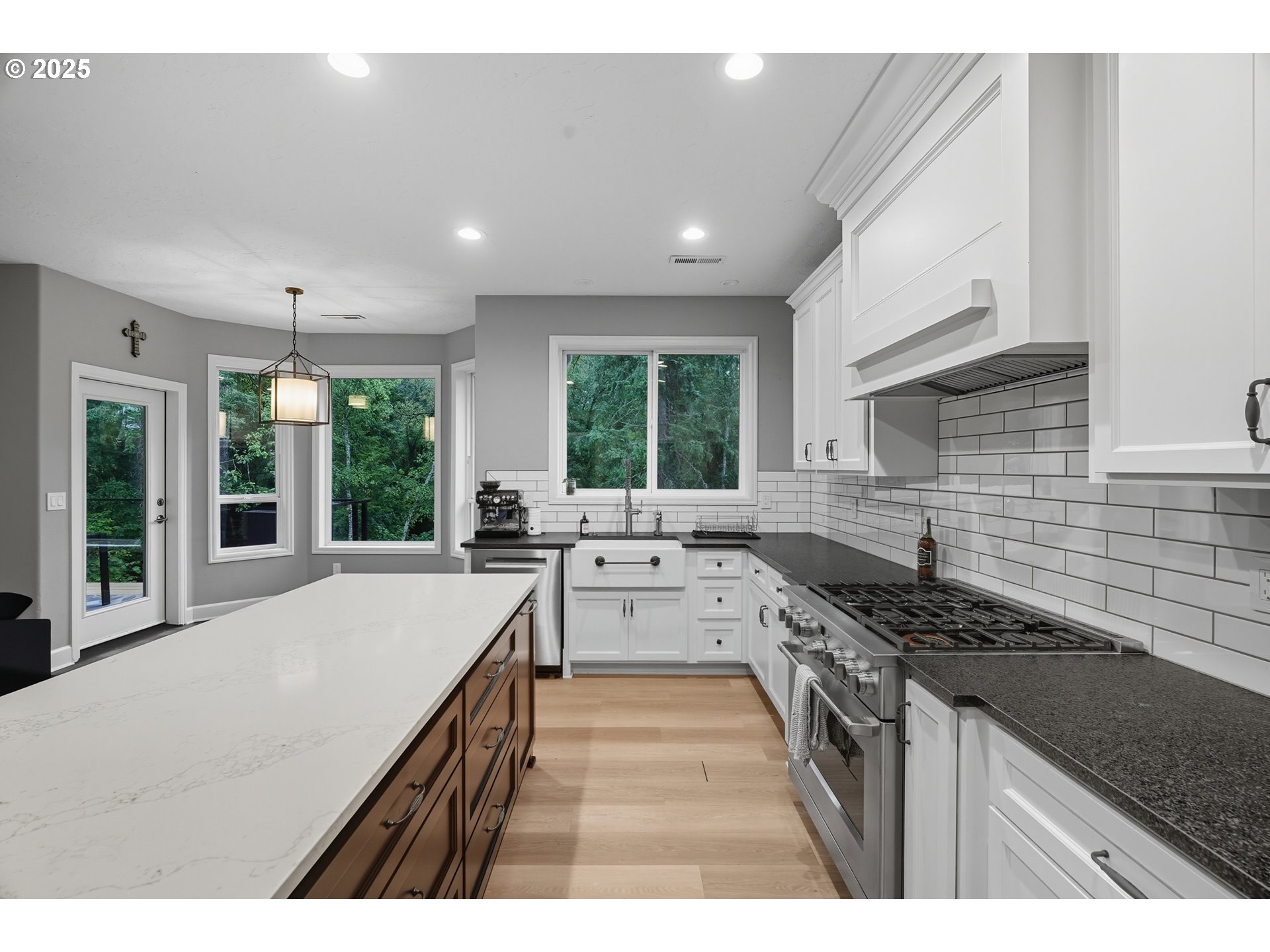 1109 Northwest Frazier Court Portland, OR 97229 - Photo 10 of 44 a kitchen with a stove a sink a refrigerator and cabinets