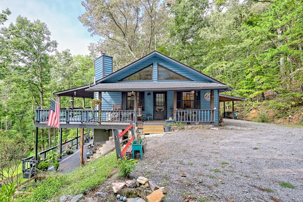 773 Rolling Oaks Road Murphy, NC 28906 - Photo 12 of 72 a front view of a house with garden