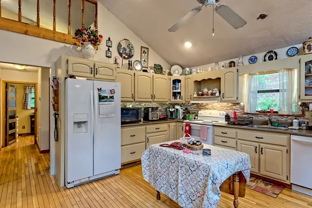 a living room with furniture fireplace and flat screen tv