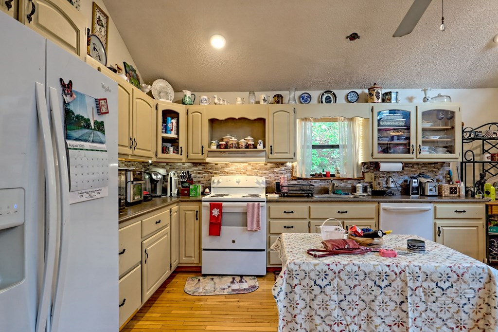 773 Rolling Oaks Road Murphy, NC 28906 - Photo 17 of 72 a kitchen with stainless steel appliances granite countertop a refrigerator and a stove top oven
