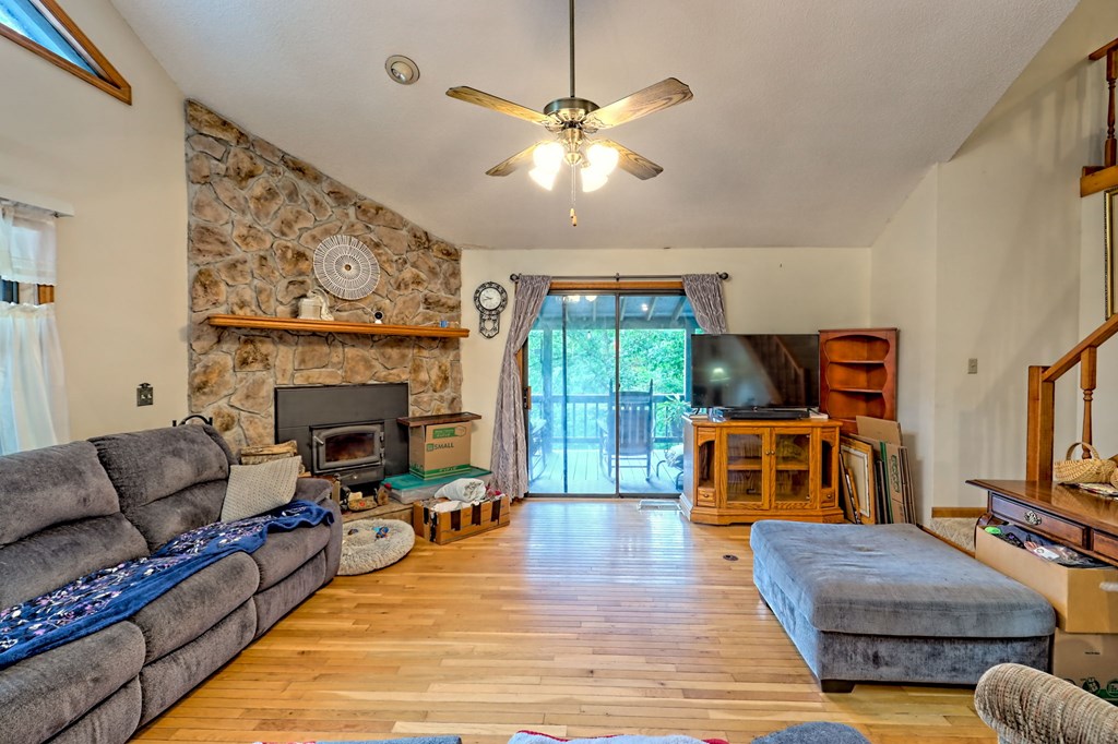 773 Rolling Oaks Road Murphy, NC 28906 - Photo 20 of 72 a living room with furniture fireplace and flat screen tv