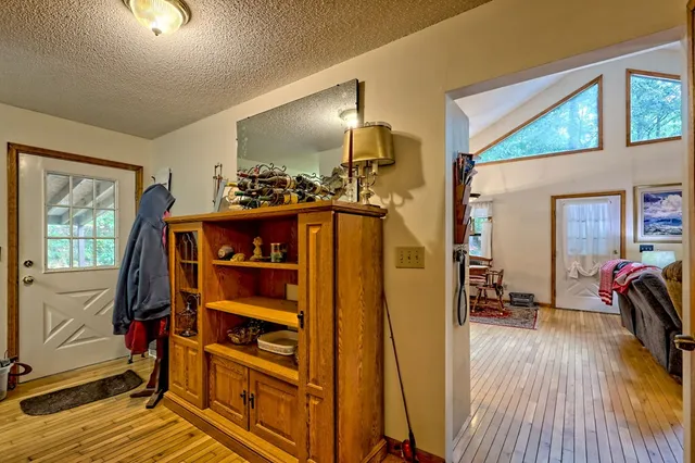 a bed room with a bed and a chandelier