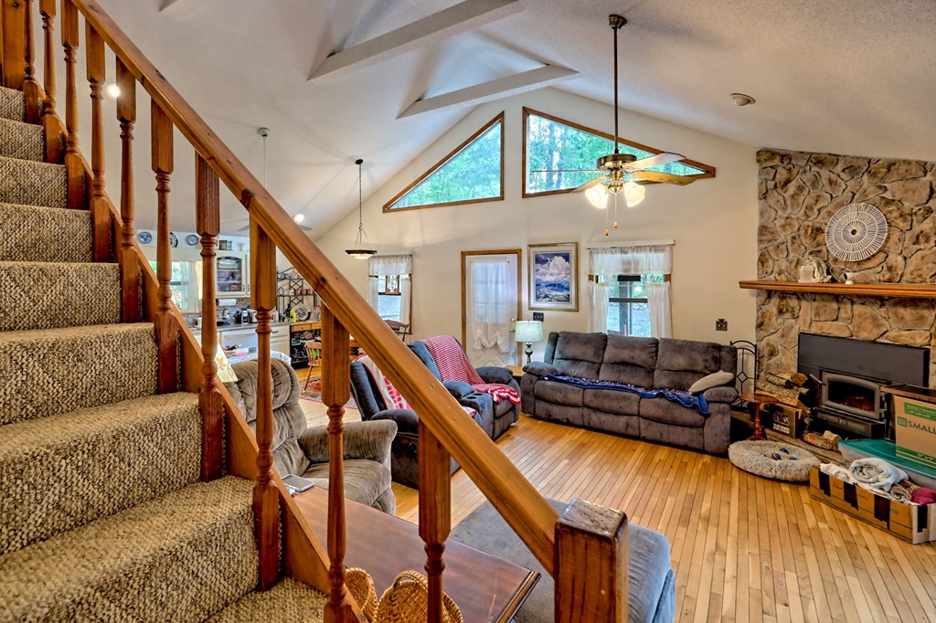 773 Rolling Oaks Road Murphy, NC 28906 - Photo 36 of 72 a living room with furniture and a wooden floor