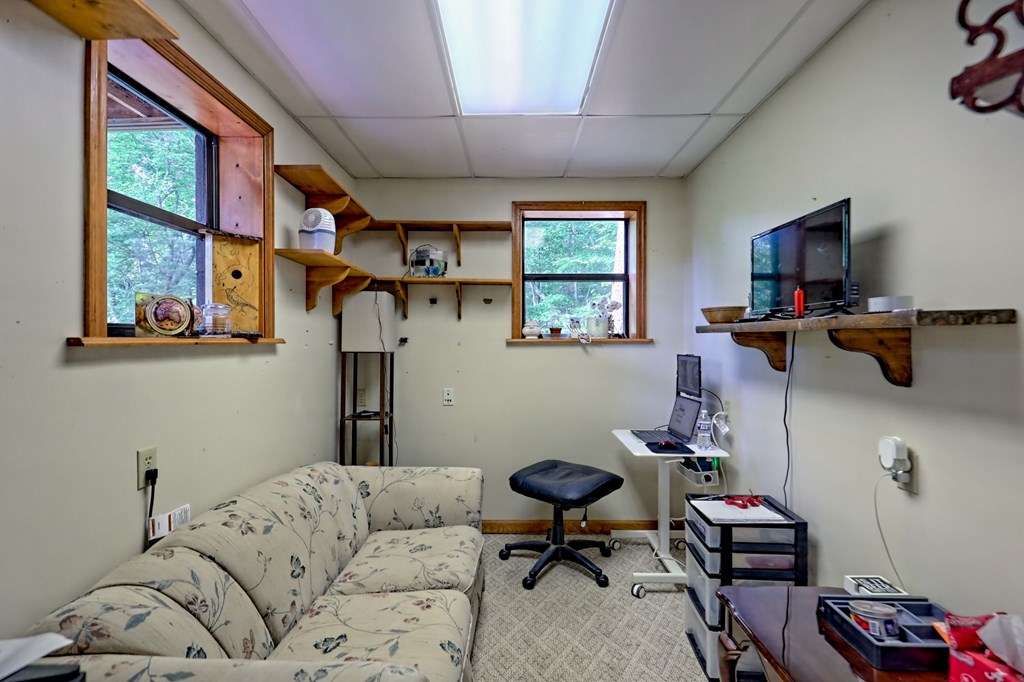 773 Rolling Oaks Road Murphy, NC 28906 - Photo 44 of 72 a living room with furniture and a window