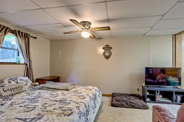 a view of yard with swimming pool and green space