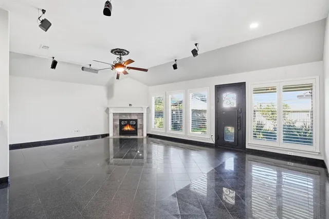 a kitchen with stainless steel appliances white cabinets and stove