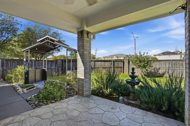 a view of a garden with a chair