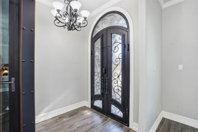 a view of an entryway with wooden floor