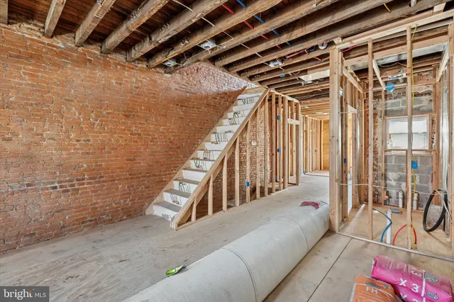 a view of an empty room with stairs