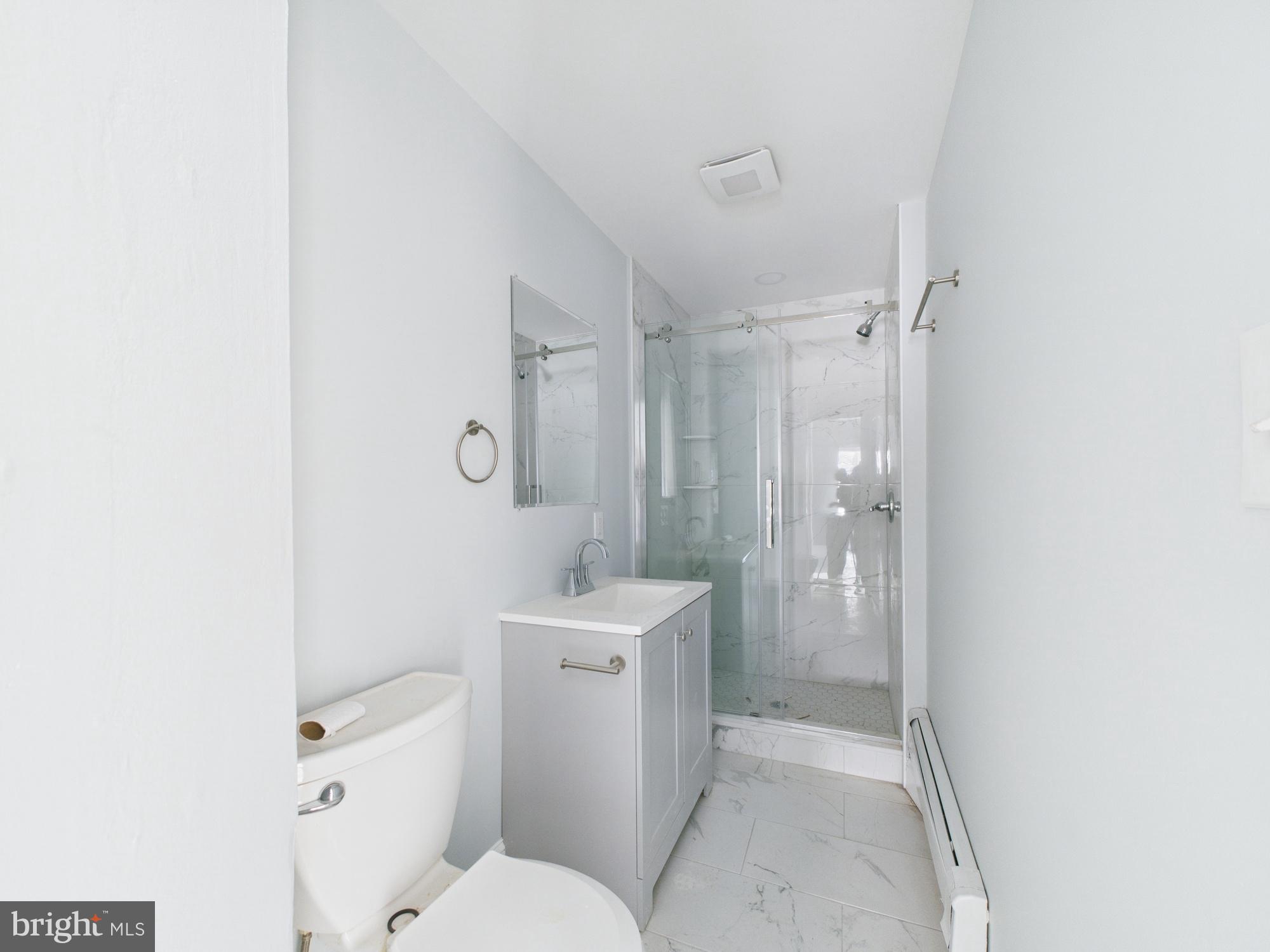 2021 Granite Street Philadelphia, PA 19124 - Photo 4 of 9 a bathroom with a toilet a sink and shower