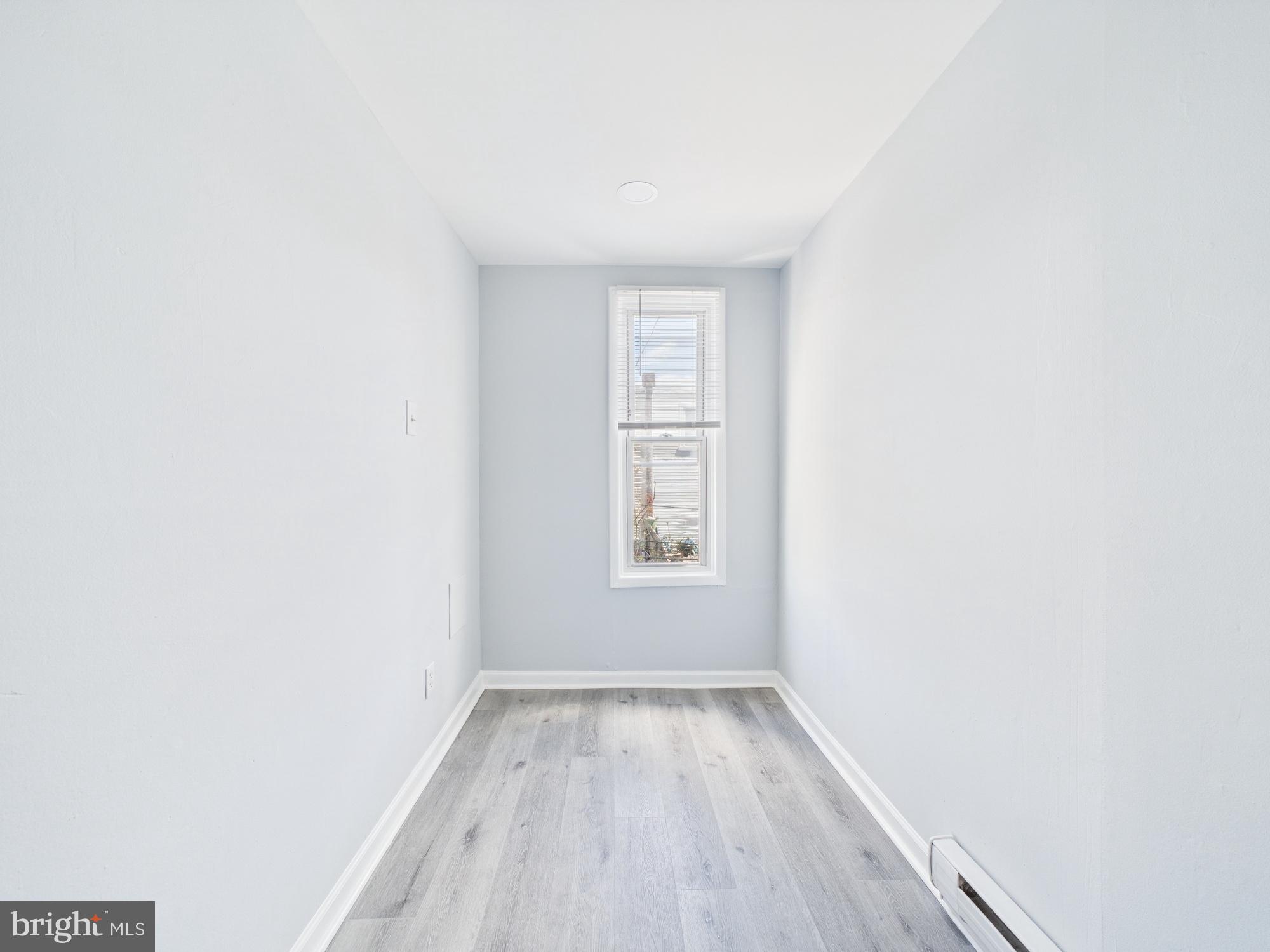 2021 Granite Street Philadelphia, PA 19124 - Photo 5 of 9 a view of a room that has wooden floor and a window