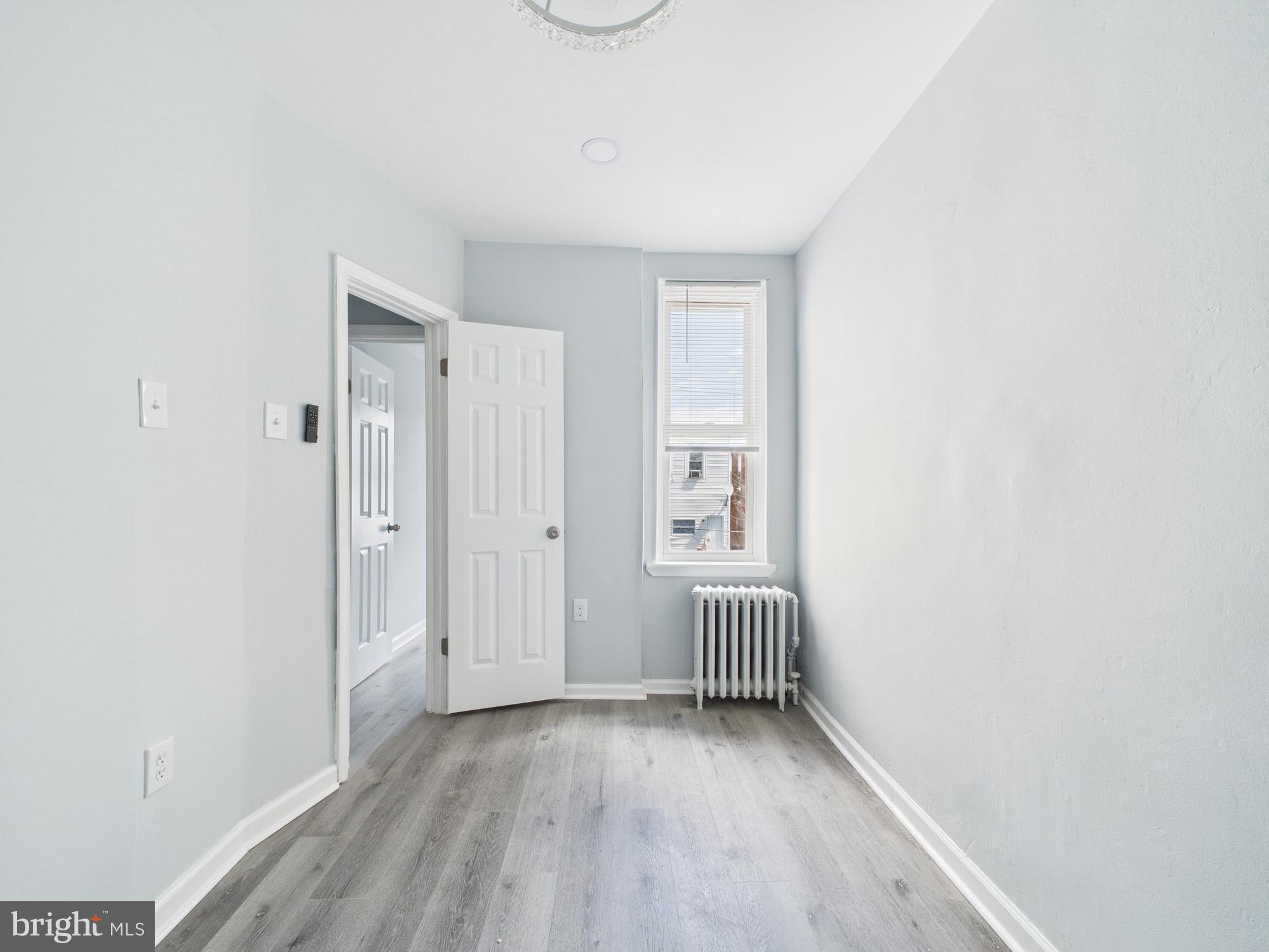 2021 Granite Street Philadelphia, PA 19124 - Photo 6 of 9 a view of a room with wooden floor and natural light