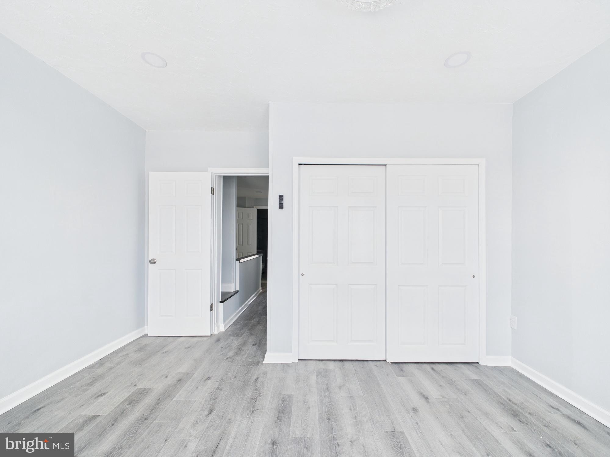 2021 Granite Street Philadelphia, PA 19124 - Photo 8 of 9 a view of an empty room with wooden floor and a window