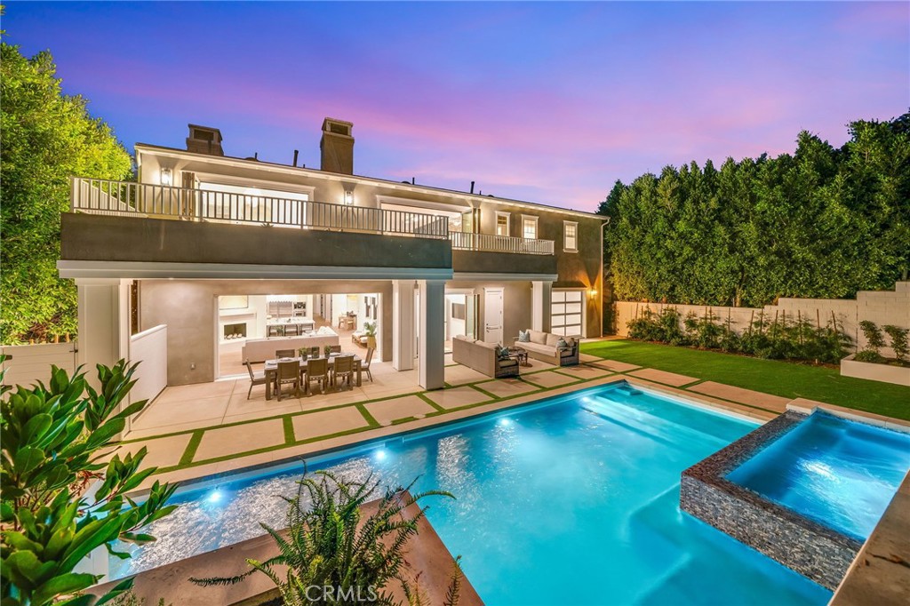 17 Boardwalk Newport Beach, CA 92660 - Photo 1 of 58 a view of a house with swimming pool lawn chairs and a yard