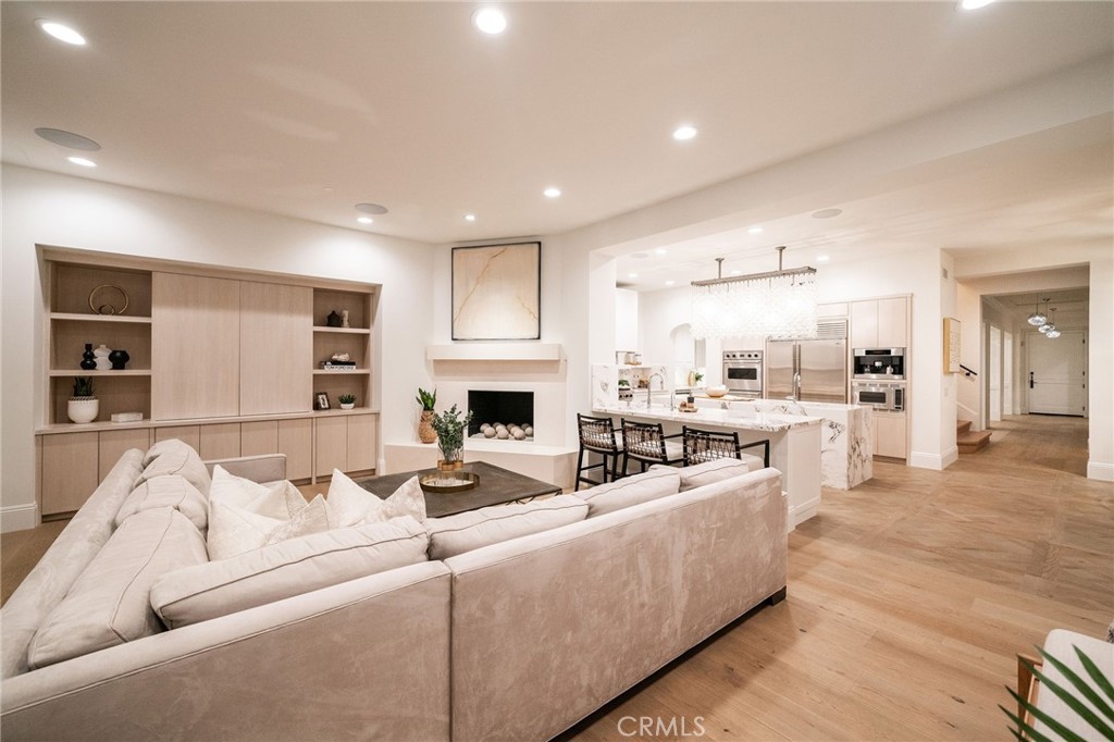 17 Boardwalk Newport Beach, CA 92660 - Photo 11 of 58 a living room with furniture and a fireplace