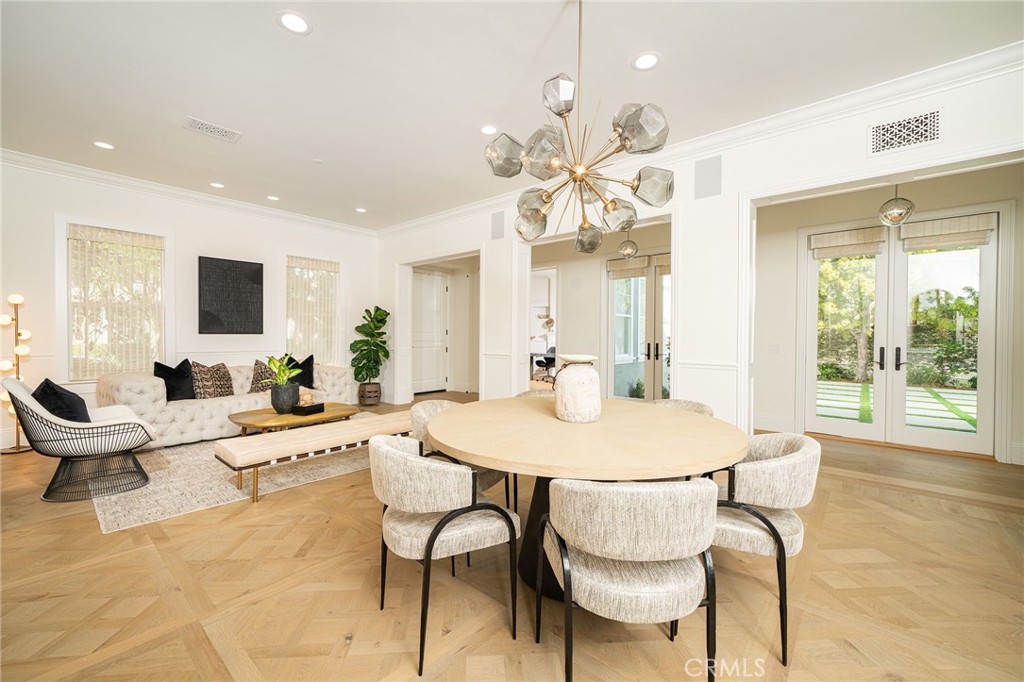 17 Boardwalk Newport Beach, CA 92660 - Photo 14 of 58 a view of a dining room with furniture and wooden floor