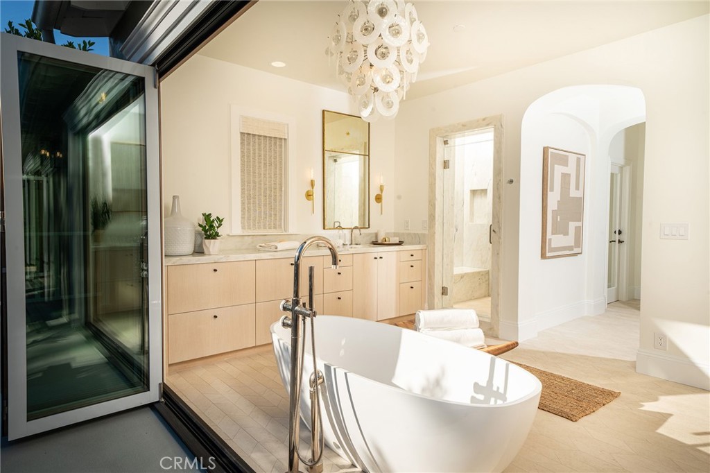 17 Boardwalk Newport Beach, CA 92660 - Photo 20 of 58 a living room with furniture and a chandelier