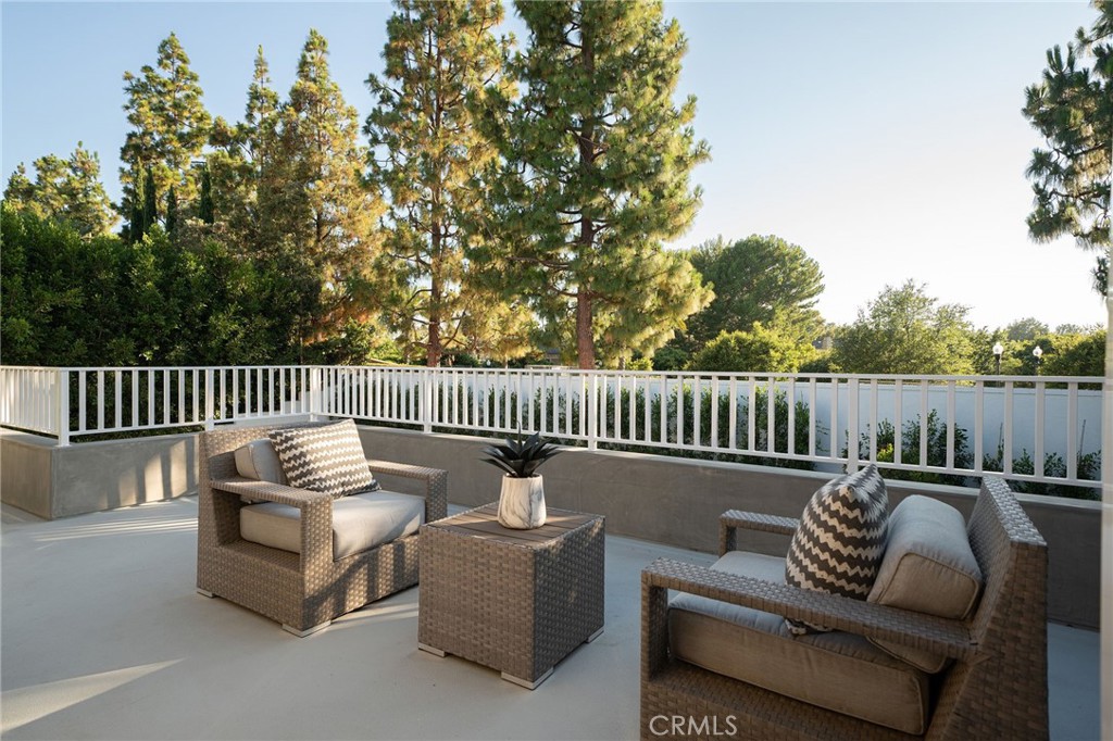17 Boardwalk Newport Beach, CA 92660 - Photo 22 of 58 a roof deck with couches and a potted plant on a table