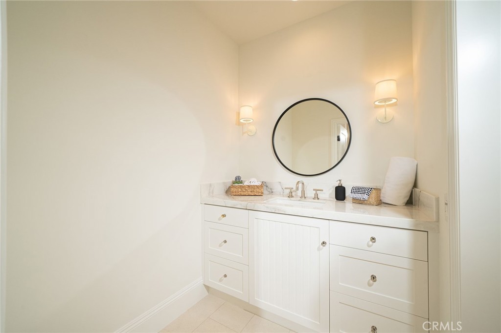 17 Boardwalk Newport Beach, CA 92660 - Photo 36 of 58 a bathroom with a sink and a mirror