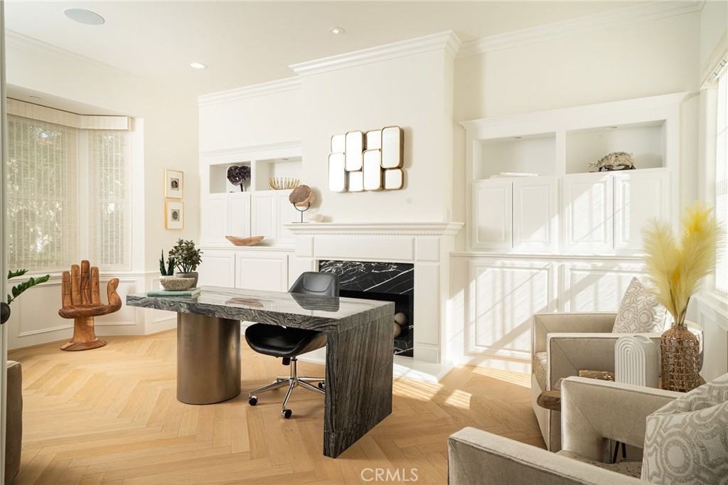 17 Boardwalk Newport Beach, CA 92660 - Photo 39 of 58 a living room with furniture a fireplace and a table