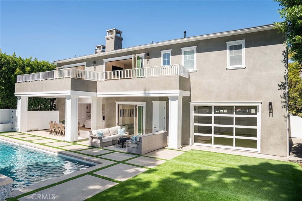 17 Boardwalk Newport Beach, CA 92660 - Photo 47 of 58 a front view of a house with a yard