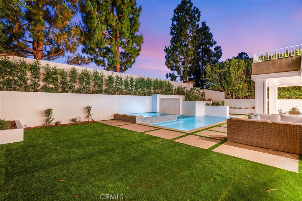 17 Boardwalk Newport Beach, CA 92660 - Photo 51 of 58 a view of a swimming pool with a yard