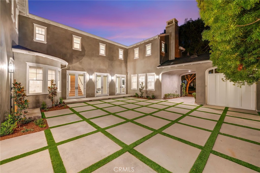 17 Boardwalk Newport Beach, CA 92660 - Photo 54 of 58 a front view of a house with a yard