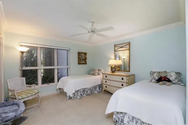 a bedroom with bed and window