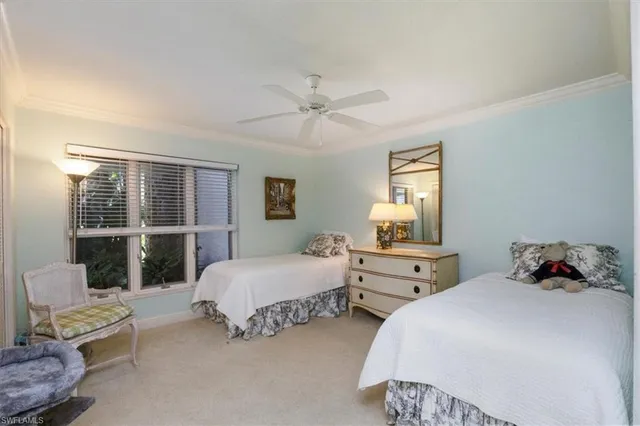 a bedroom with bed and window