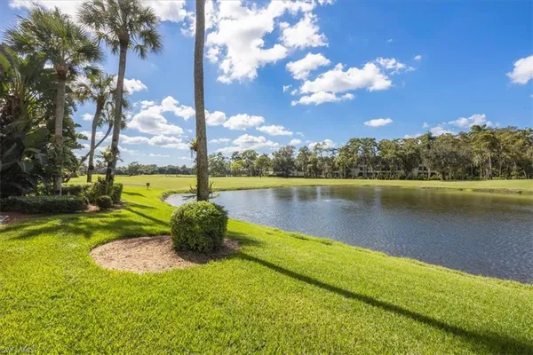 a view of a lake with a big yard