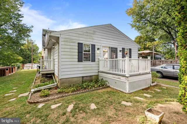 a view of a house with a wooden fence