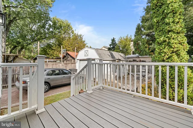 a view of balcony with deck and trees