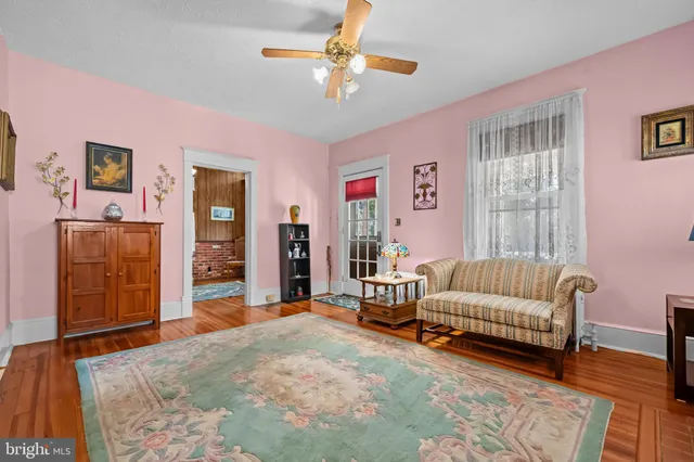 a bedroom with a bed furniture and a window