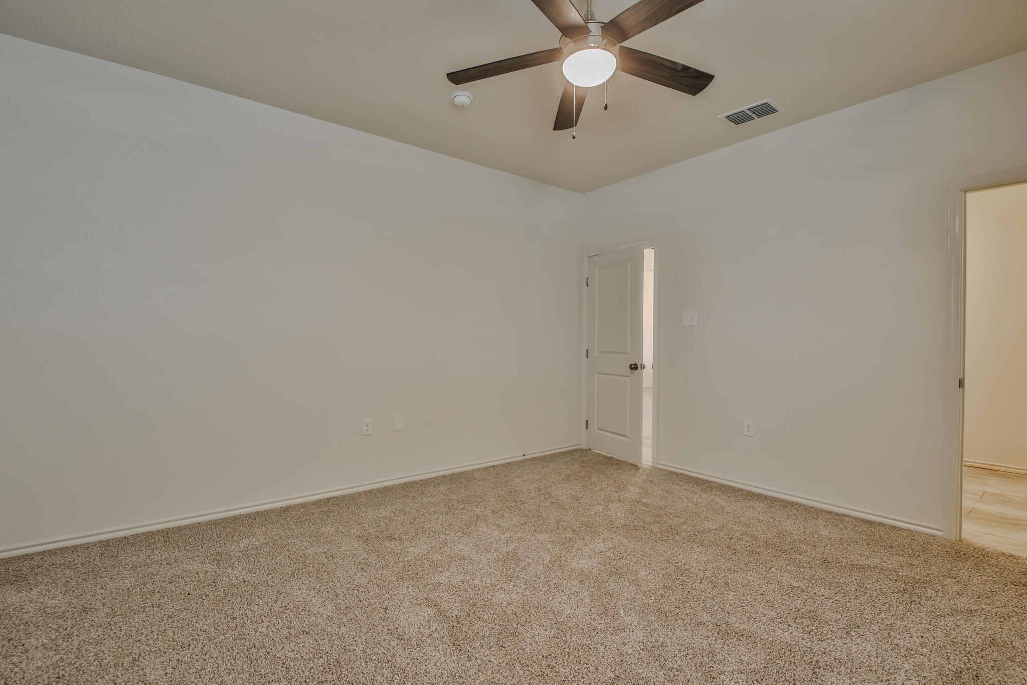 5512 Kemper Street Lubbock, TX 79416 - Photo 22 of 34 an empty room with a window and a fan