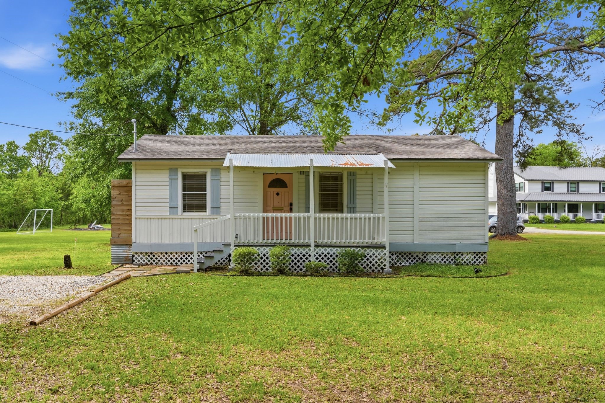11757 Calvary Road Willis, TX 77318 - Photo 1 of 33 Welcome home! This charming front porch is a great spot to sit and relax. The large yard and mature trees give it a peaceful, open feel.