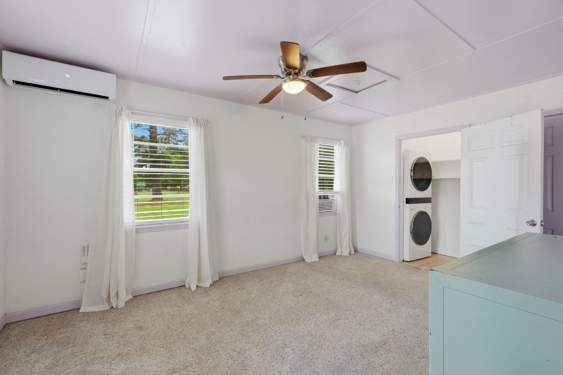 11757 Calvary Road Willis, TX 77318 - Photo 13 of 33 Bright and functional room ideal for a bedroom or flex use, complete with convenient laundry setup.