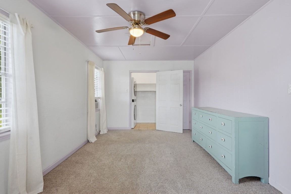 11757 Calvary Road Willis, TX 77318 - Photo 14 of 33 Comfortable bedroom with plenty of space to relax, plus convenient access to the laundry area.