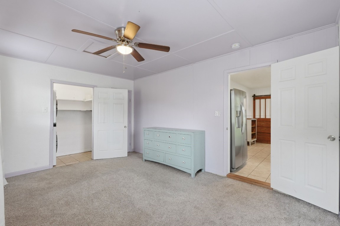 11757 Calvary Road Willis, TX 77318 - Photo 15 of 33 This bedroom feels open and comfortable, with good natural light and the convenience of nearby laundry.