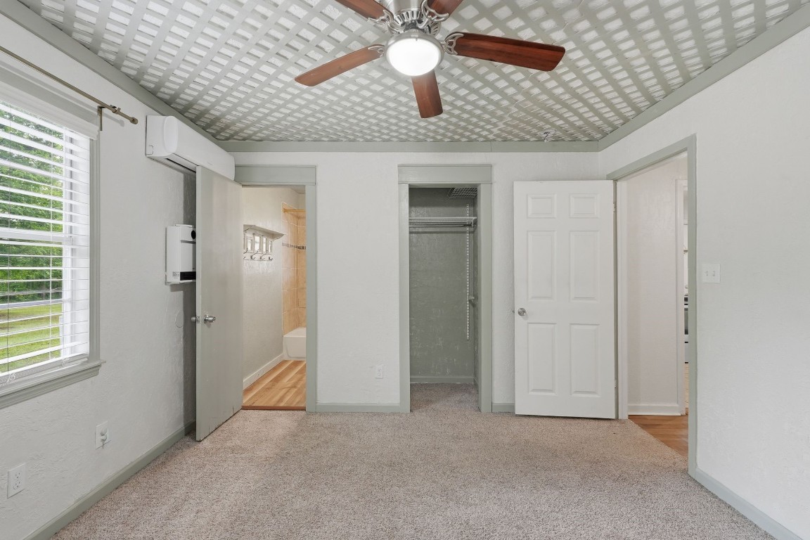 11757 Calvary Road Willis, TX 77318 - Photo 18 of 33 Another view of the bedroom showing its open space, closet area, and convenient connection to nearby rooms.